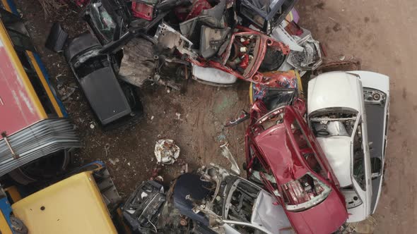 Old Car Junkyard with the Pile of Old Damaged Cars