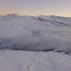 Aerial Revealing Shot Of A Ski Resort In Switzerland During Sunrise - VideoHive Item for Sale