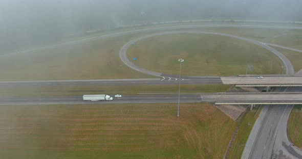 This is a Panoramic View of Dense Fog in the Early Morning Near the Bridge Spanning the US 65