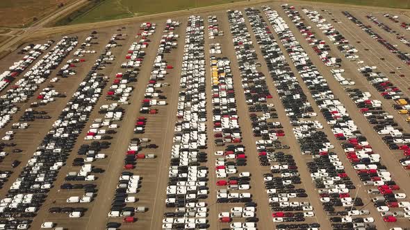 Many new and occasion Cars on a huge parking lot waiting for shipment, Aerial