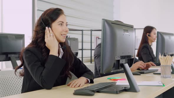 Business People Wearing Headset Working in Office