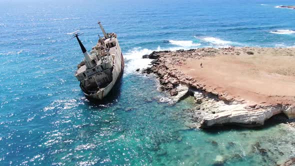 Flying Over Coastline with Broken Ship