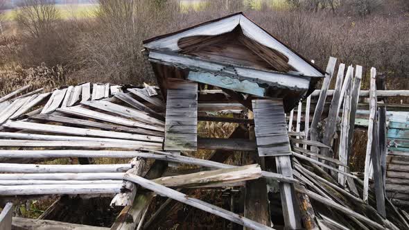 An Abandoned Uninhabited Rural House with a Collapsed Roof Aerial View