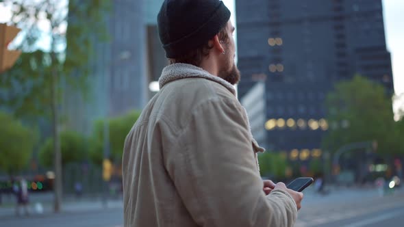 Positive man standing in the city