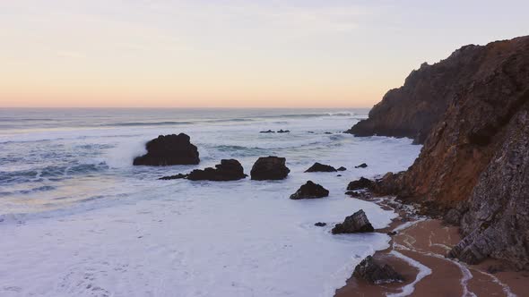 Aerial Drone View of Lisbon Beach, on the Portugal Coast by Sintra at Praia da Adraga, a Beautiful S