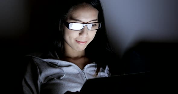 Woman Using Digital Tablet Computer at Home