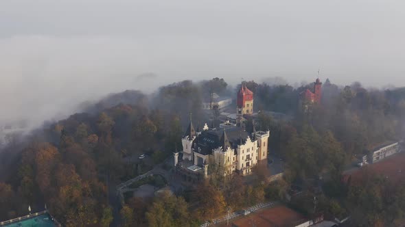 A Small Castle on the Mountain During Foggy Weather. Castle Standing on the Hill in Kiev