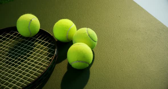 Racket and tennis ball in court 4k