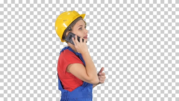 Beautiful young builder woman wear a yellow safety helmet