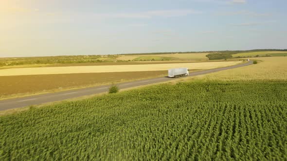 Cargo truck with cargo trailer driving on a highway. 