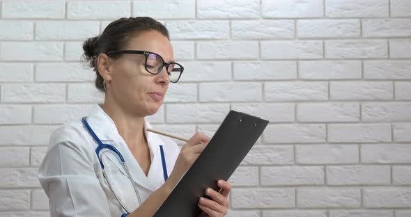 Cheerful Doctor with Documents