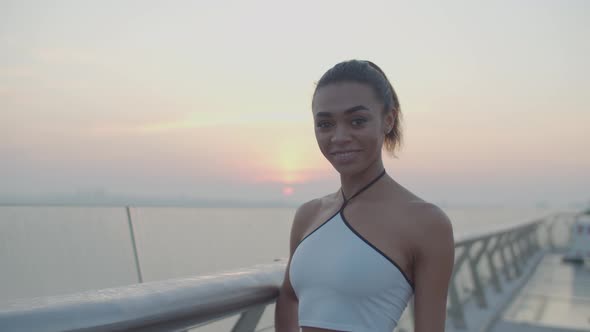 Portrait of Pretty Sporty Black Woman at Sunrise