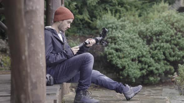 Camera stabilizing gimbal, nature background