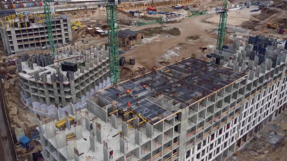 Busy Construction Site and Construction Equipment Aerial Top View