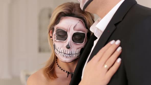 Creepy Couple of Actors with Scary Halloween Makeup in Vintage Costumes