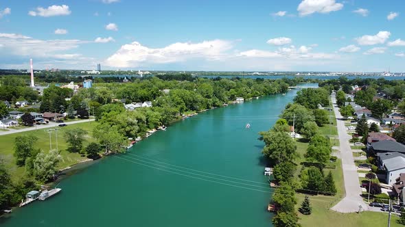 Aerial backwards view of welland river in Chippawa city in the near of Niagara Falls in Canada durin