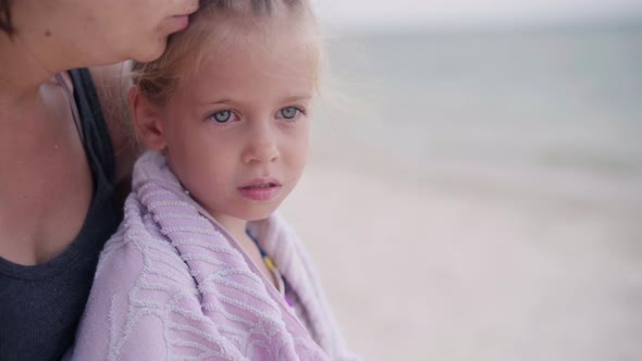 Mother Hugging Warms Little Daughter Wipes Towel Beach Outdoor Sunny Day Close Up