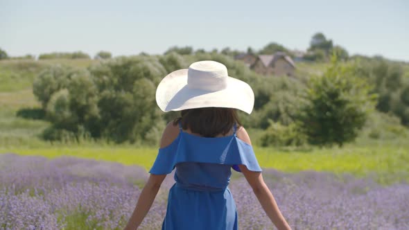 Smiling Woman Gestures Follow Me in Lavender Field