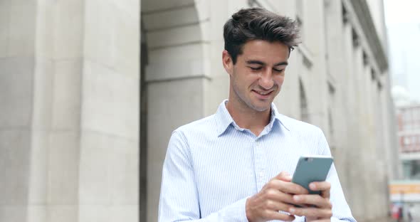 Man use of mobile phone in Hong Kong city