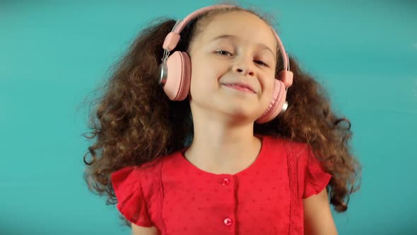 Child On Relaxing on With Eyes Closed Wearing Headphones