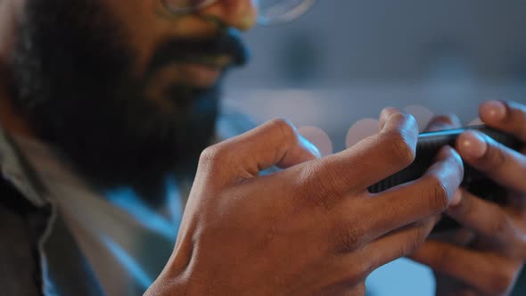 Close Aup Details Male Hands Unrecognizable Bearded Man at Home in Evening Night in Darkness Playing