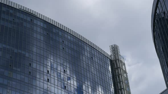 Skyscraper And Blue Clouds