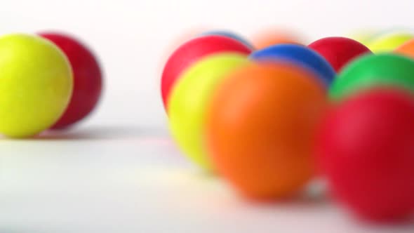 Extreme close-up gumballs rolling, Slow Motion