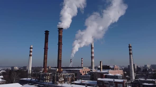 Aerial view of a drone flying over an industrial plant