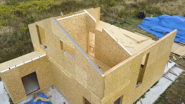 Construction of new and modern modular house. Walls made from composite wooden sip panels 