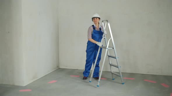 Female with Ladder Preparing for Renovating House