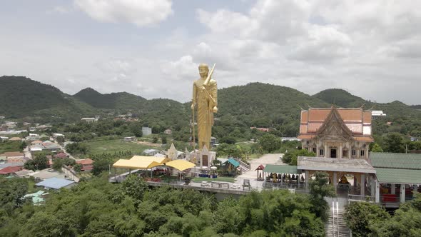 Scenic Landscape of Giant Golden Buddha Standing on Wat Khao Noi Temple, Hua Hin. Thailand