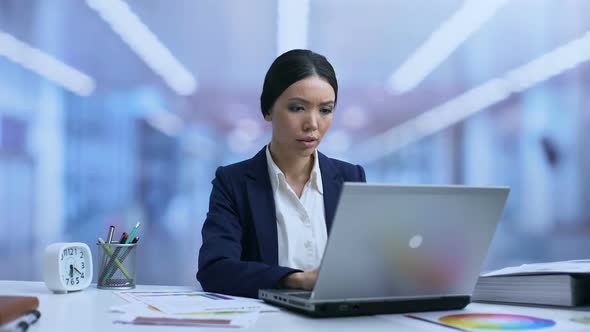 Young Business Lady Meditating in Office Reducing Stress, Relaxing Technique