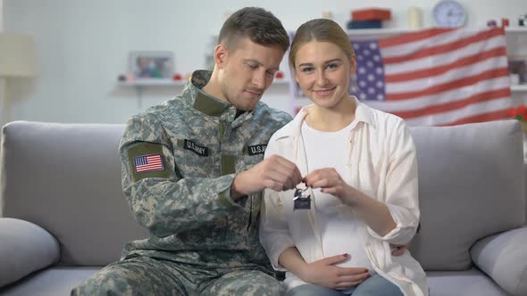 American Male Soldier and His Wife Holding House Key Reward for Military Service