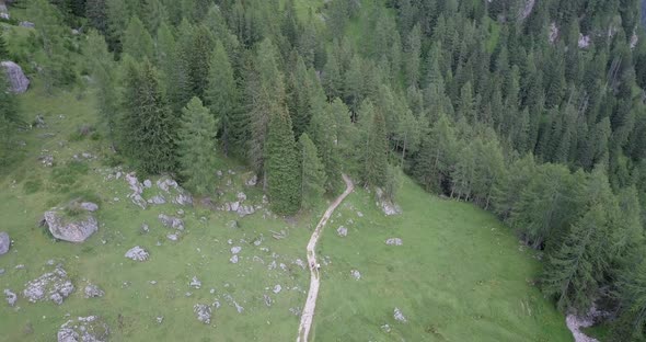 Aerial drone view of hikers hiking in the mountains.