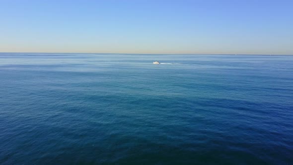 Aerial drone uav view of a motor boat and the ocean.