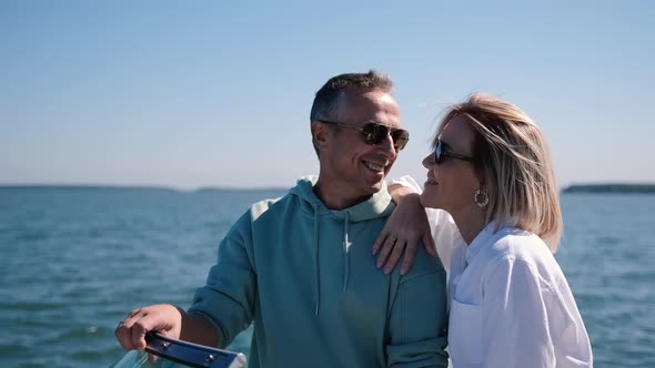 An Adult Couple Ride a Speedboat