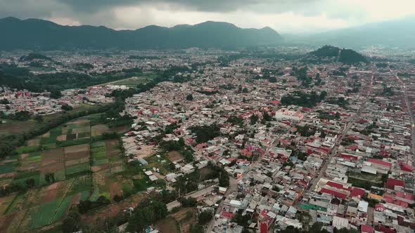 Aerial of san Cristobal de las casas chiapas Mexico with mountains landscape, drone panoramic of vil