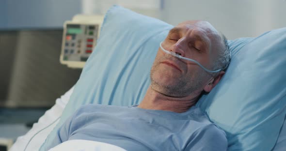 Man Lying in Hospital Bed