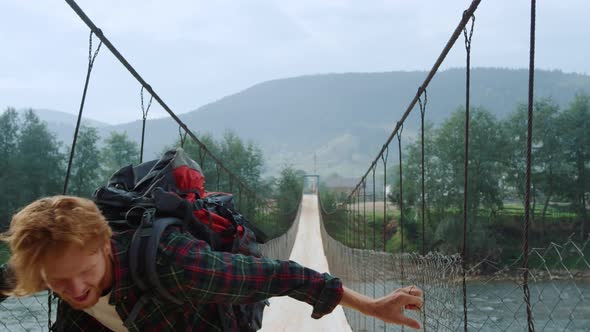 Euphoric Hiker Jump Outdoors on River Bridge