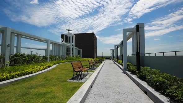 Modern Style Garden on the Buiding Rooftop with Clear Blue Sky Background