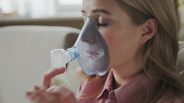 Close Up Sick Female Using Oxygen Mask at Home a 30s Woman Has Labored Breathing Treatment at Home