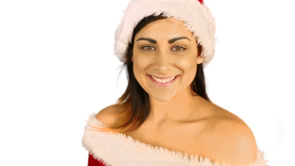 Sexy santa girl sending an air kiss to camera