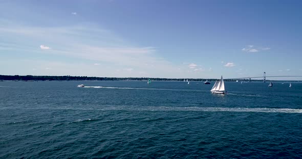 Sailboats entering and leaving Mt. Hope Bay in Newport Rhode Island as well as returning from Block