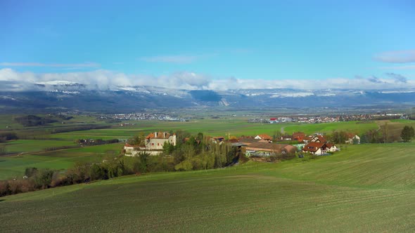 Landscape of a small town in a valley against the backdrop of the mountains of Switzerland