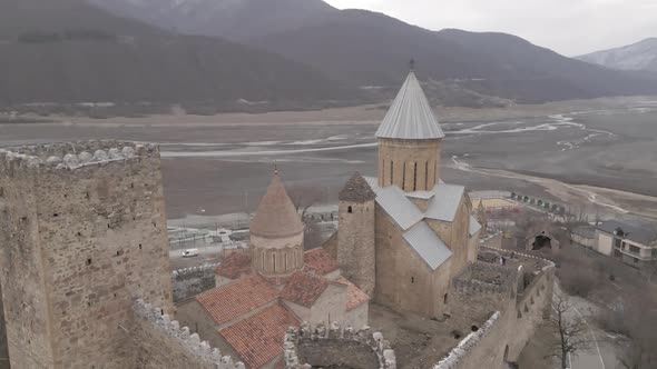 Aerial view of old Ananuri Fortress with two churches and picturesque view on river. Georgia 2021