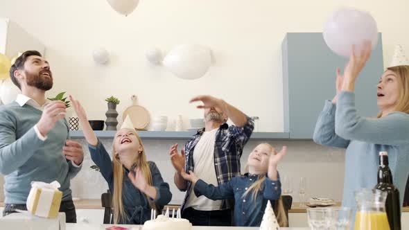 Multigeneration Family on a Indoor Birthday Party