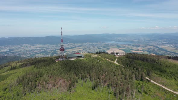 Aerial view of Skrzyczne Hill in Silesian Beskid and Żywieckie lake the background. Szczyrk, Poland.