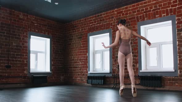 Ballet Dancing  a Little Strong Girl Dancing on Pointe Shoes in the Studio