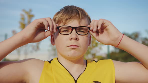 Face of a young nerd with glasses