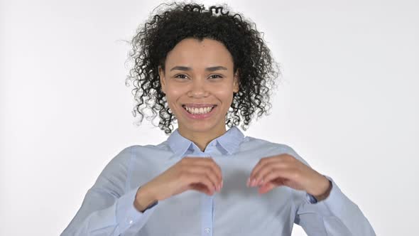 Portrait of Young African Woman Making Heart Shape with Hand